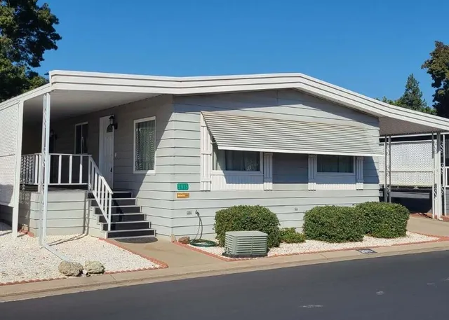 a front view of a house with garage