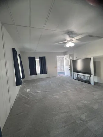 a view of a livingroom with furniture and chandelier
