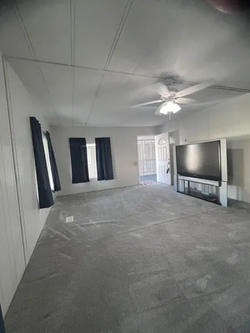 a view of a livingroom with furniture and chandelier