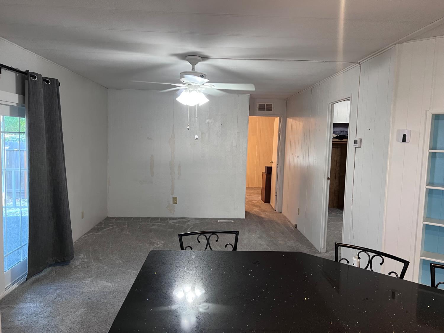 3913 Waimea Lane Modesto, CA 95355 - Photo 18 of 32 wooden floor in an empty room with a window