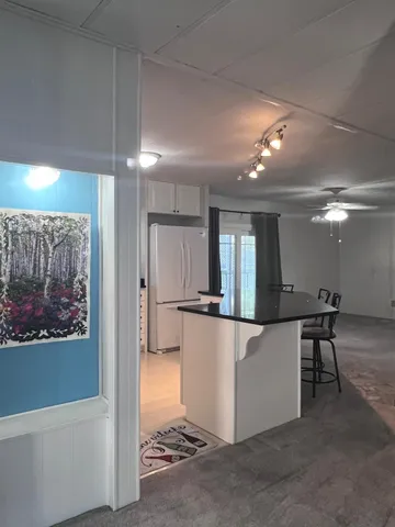 a view of a living room and a large window