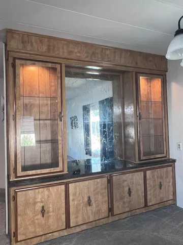 a view of a livingroom with furniture and windows