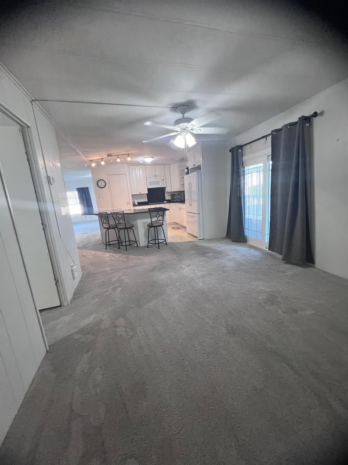 3913 Waimea Lane Modesto, CA 95355 - Photo 21 of 32 a view of a livingroom with furniture and windows