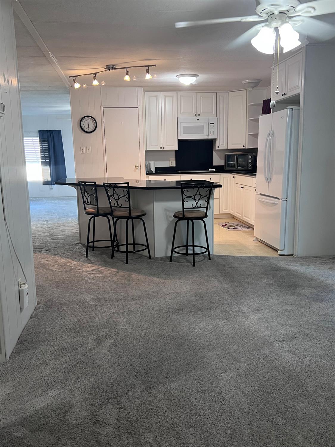 3913 Waimea Lane Modesto, CA 95355 - Photo 22 of 32 a kitchen with stainless steel appliances a refrigerator and a stove top oven