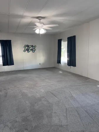 a view of a hallway with chandelier