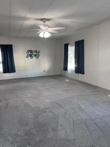 a view of a hallway with chandelier