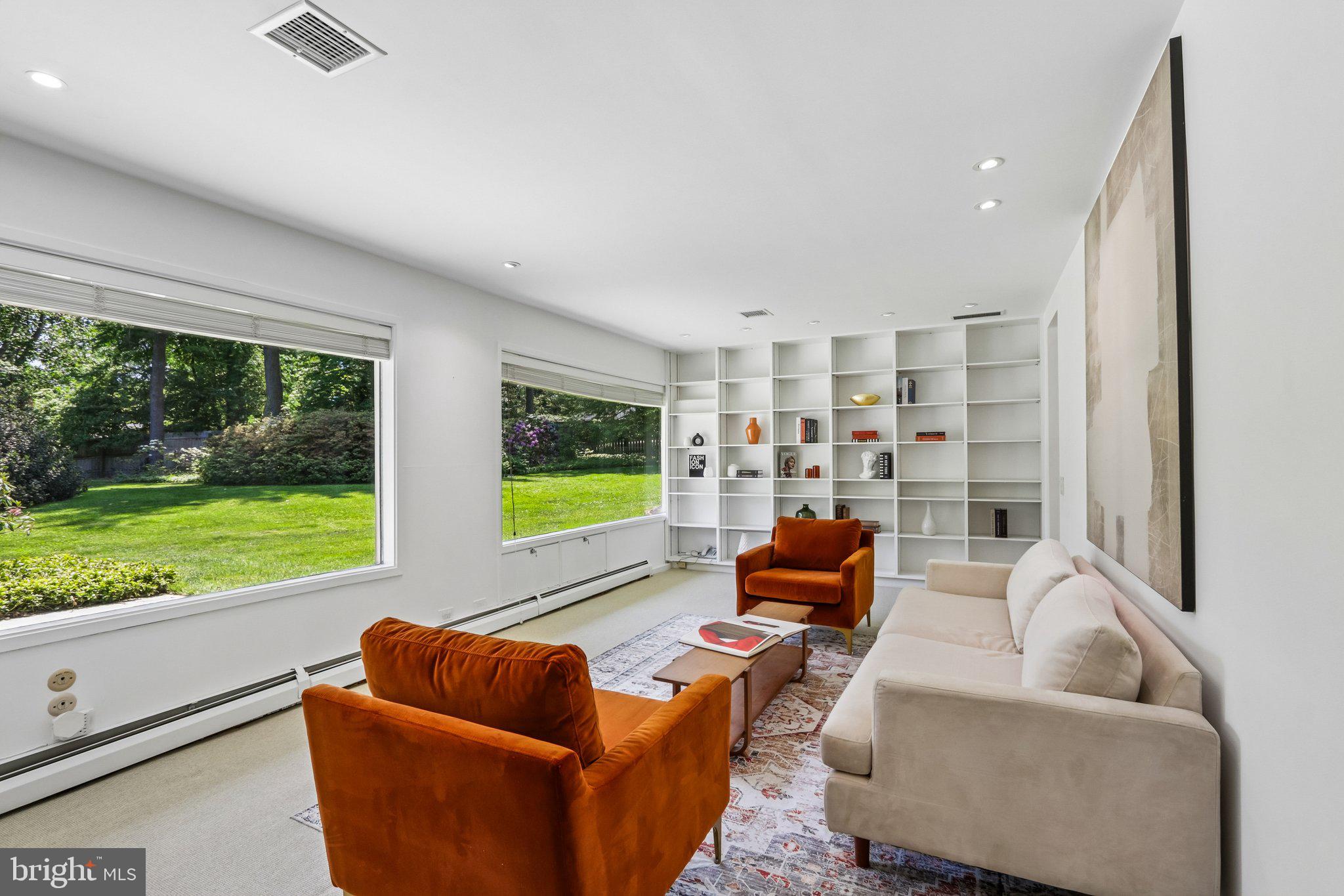 1673 Paper Mill Road Jenkintown, PA 19046 - Photo 27 of 73 a living room with furniture fireplace and flat screen tv