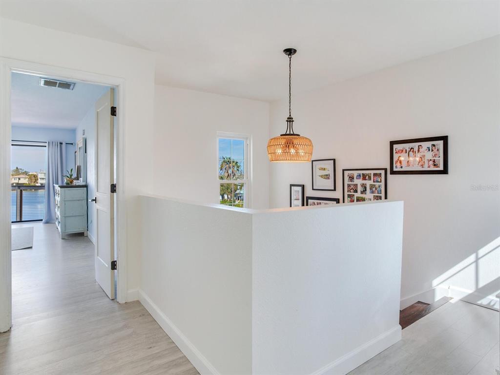 410 140th Avenue East Madeira Beach, FL 33708 - Photo 30 of 77 a view of a kitchen with a refrigerator