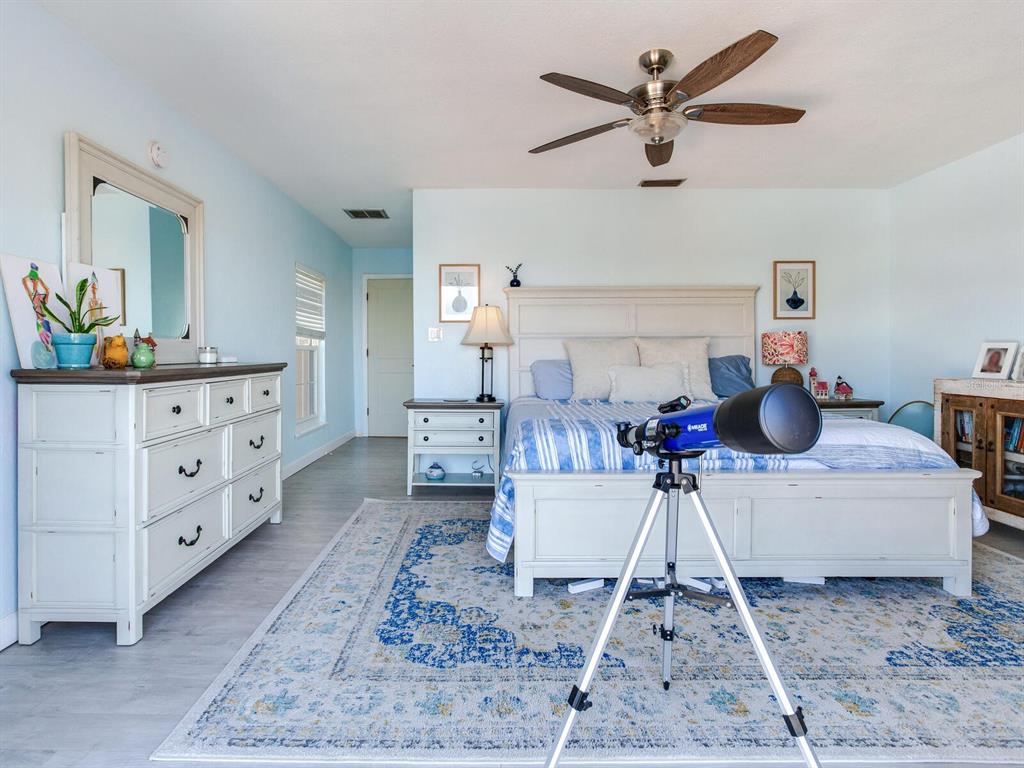 410 140th Avenue East Madeira Beach, FL 33708 - Photo 39 of 77 a living room with furniture and a rug
