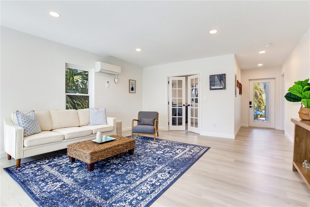410 140th Avenue East Madeira Beach, FL 33708 - Photo 55 of 77 a living room with furniture and a rug