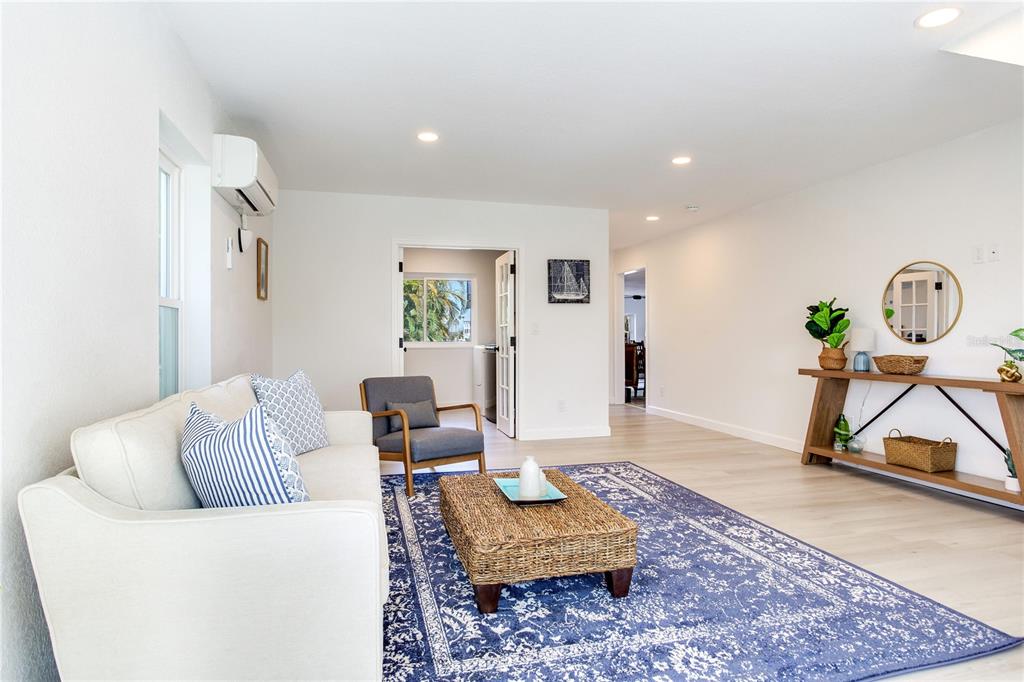 410 140th Avenue East Madeira Beach, FL 33708 - Photo 56 of 77 a living room with furniture and a rug