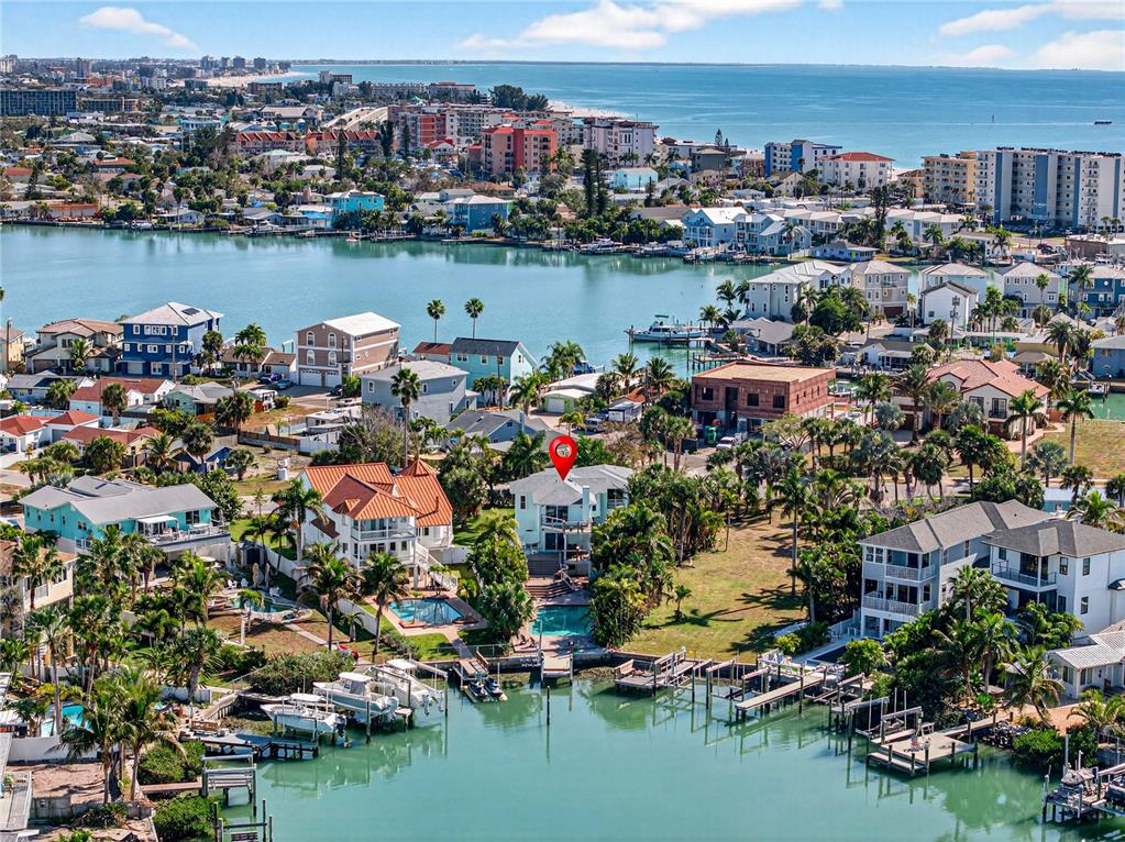 410 140th Avenue East Madeira Beach, FL 33708 - Photo 6 of 77 an aerial view of residential houses with outdoor space and lake view