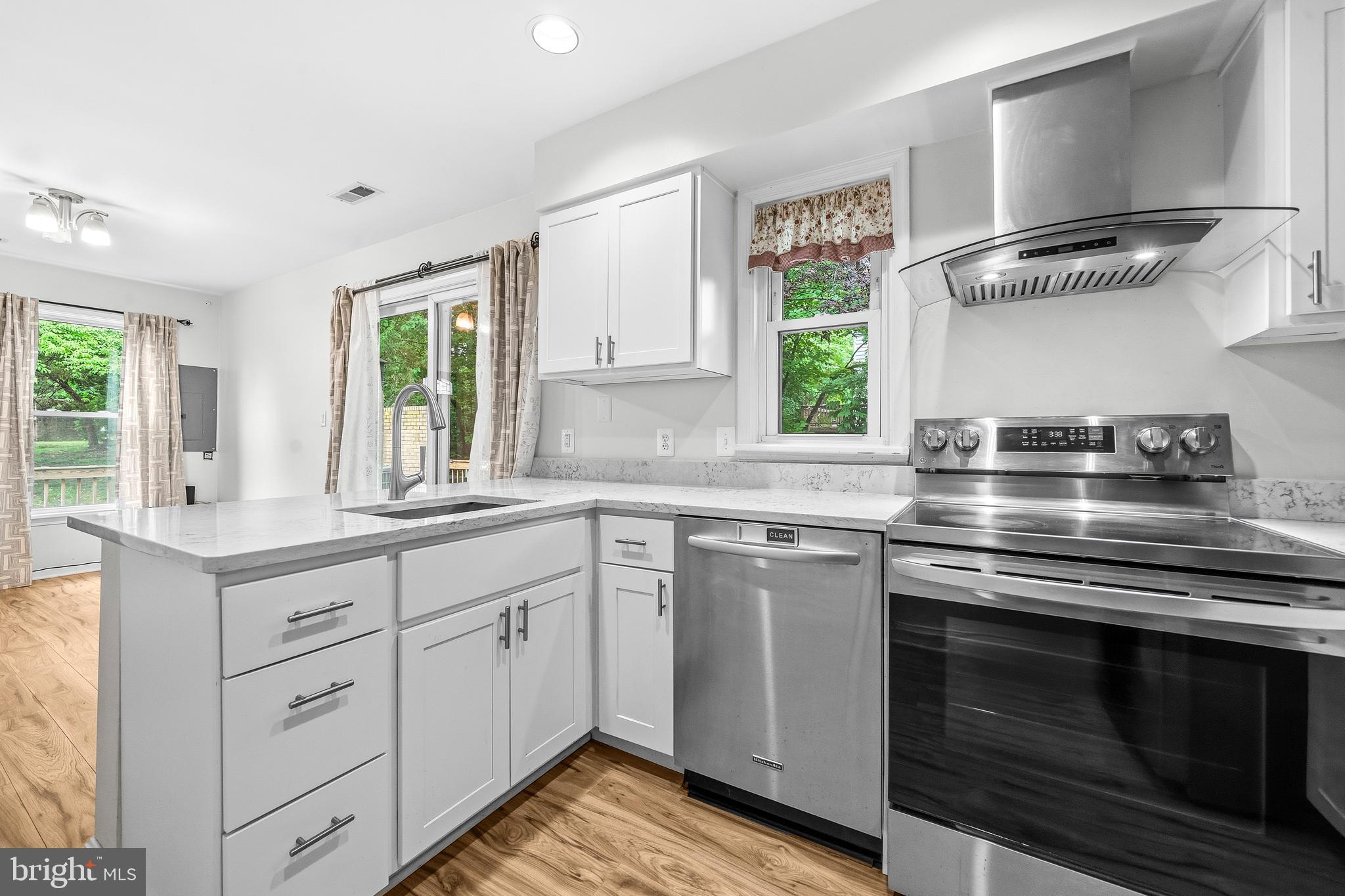 6001 Rabbit Hill Court Centreville, VA 20121 - Photo 12 of 46 a kitchen with cabinets appliances and a window