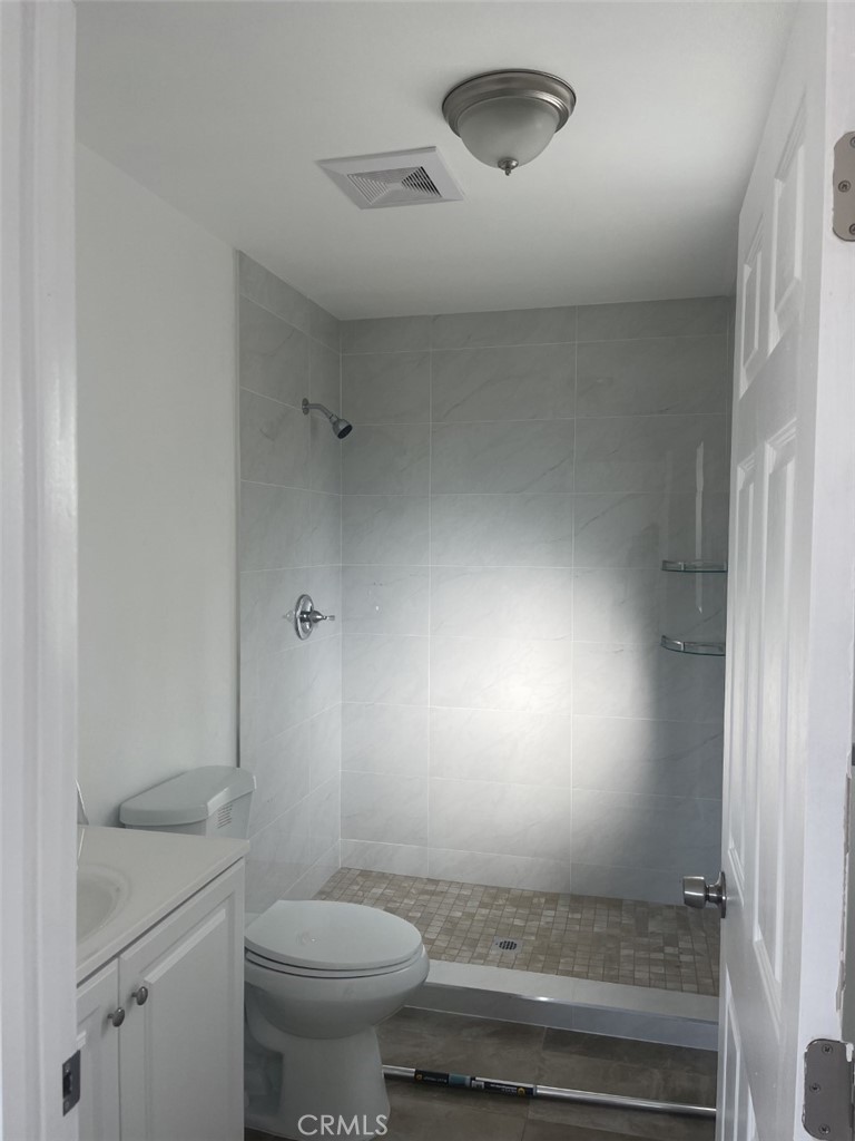 145 Miramonte Drive Fullerton, CA 92835 - Photo 3 of 8 a bathroom with a sink mirror vanity and toilet