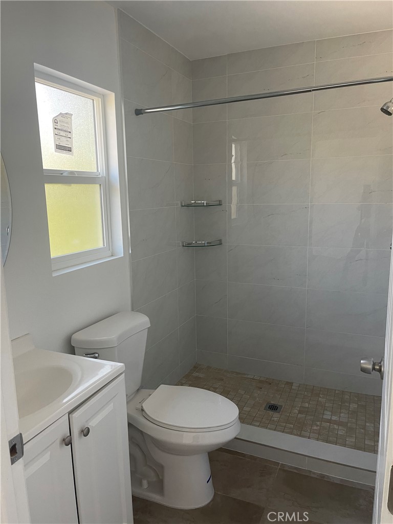 145 Miramonte Drive Fullerton, CA 92835 - Photo 4 of 8 a bathroom with a sink a toilet and shower