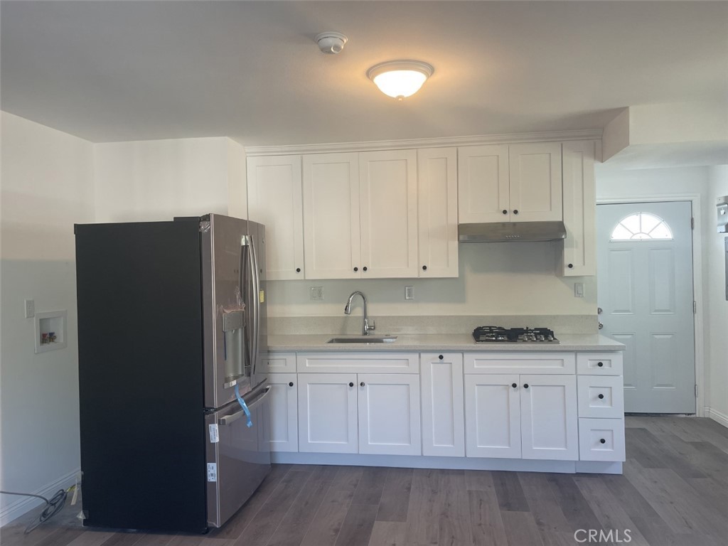 145 Miramonte Drive Fullerton, CA 92835 - Photo 6 of 8 a kitchen with a sink and a refrigerator