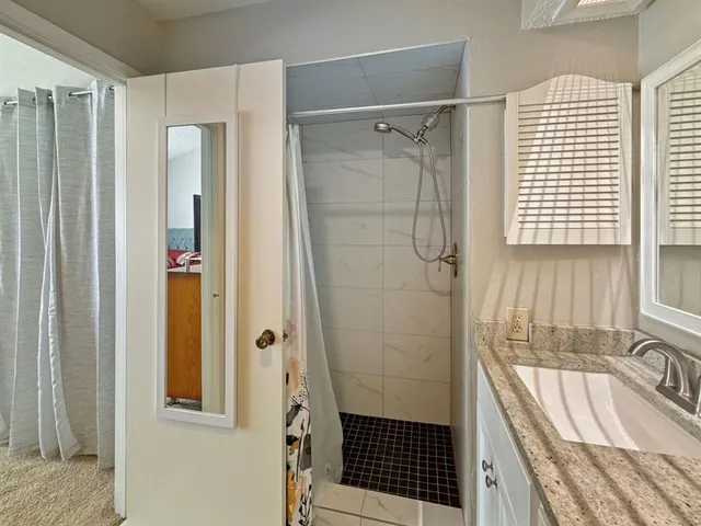 a bathroom with a sink and a shower