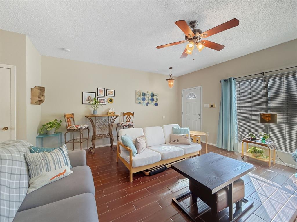 214 Samuel Boulevard, Unit 1H Coppell, TX 75019 - Photo 14 of 21 a living room with furniture and a view of kitchen