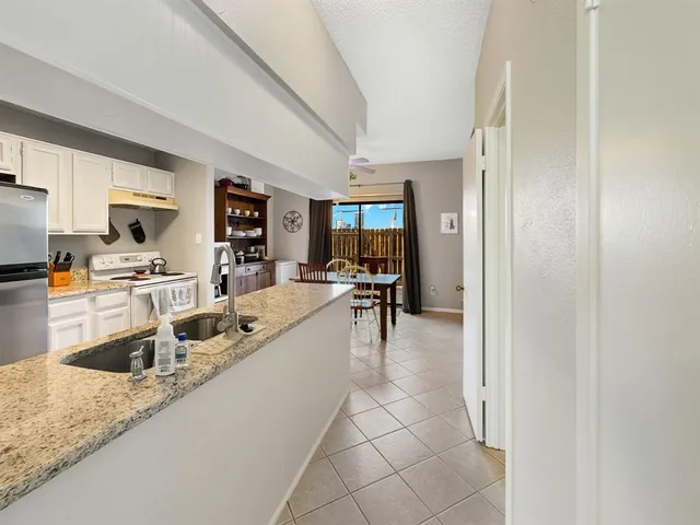 a very nice looking kitchen with a large window