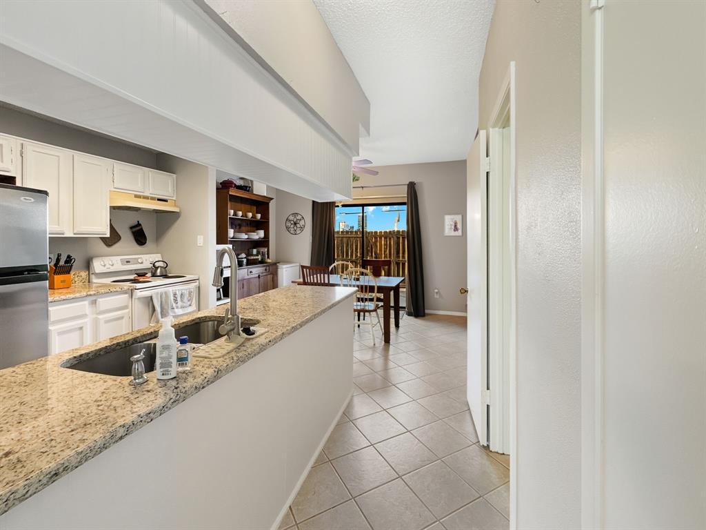214 Samuel Boulevard, Unit 1H Coppell, TX 75019 - Photo 15 of 21 a very nice looking kitchen with a large window