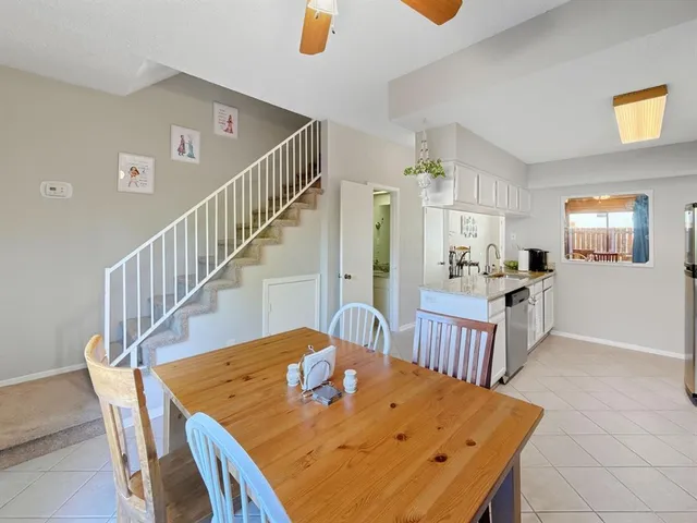 a view of a dining room with furniture and a table
