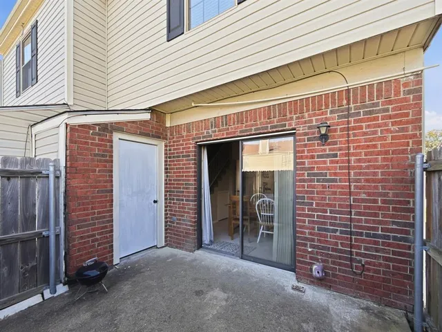 a view of a brick house with an empty space