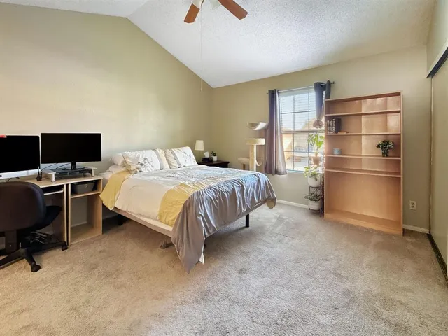 a bedroom with a bed furniture and a flat screen tv