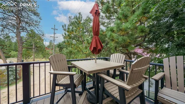 a view of a balcony with furniture