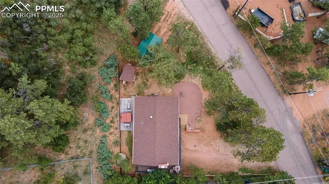 an aerial view of a house with outdoor space