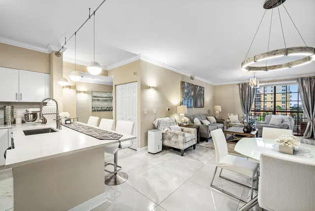 a kitchen with sink refrigerator and cabinets