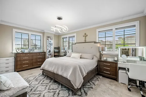 a bedroom with a bed and a desk