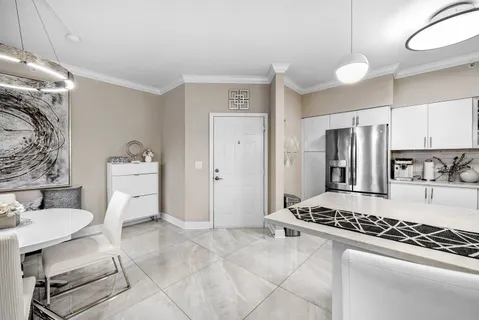 a kitchen with stainless steel appliances granite countertop a stove and a refrigerator