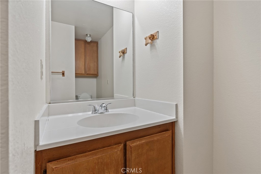 23561 Short Way Crestline, CA 92325 - Photo 13 of 18 a bathroom with a sink and a mirror