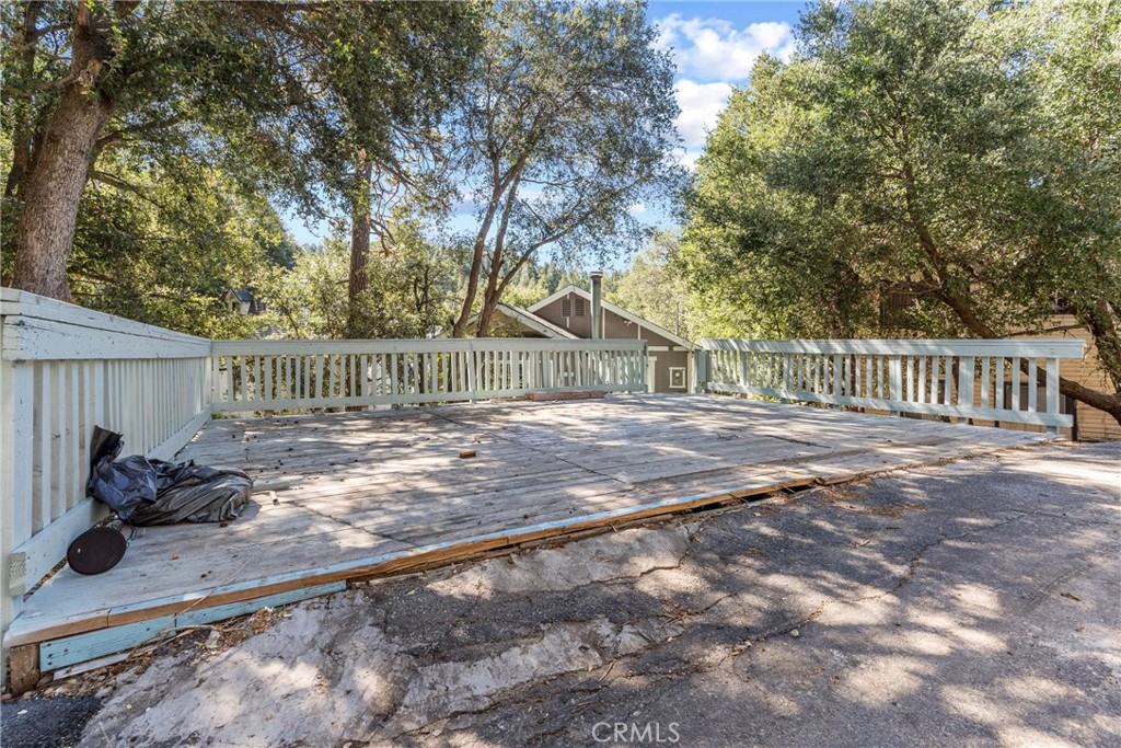 23561 Short Way Crestline, CA 92325 - Photo 2 of 18 a backyard of a house with table and chairs