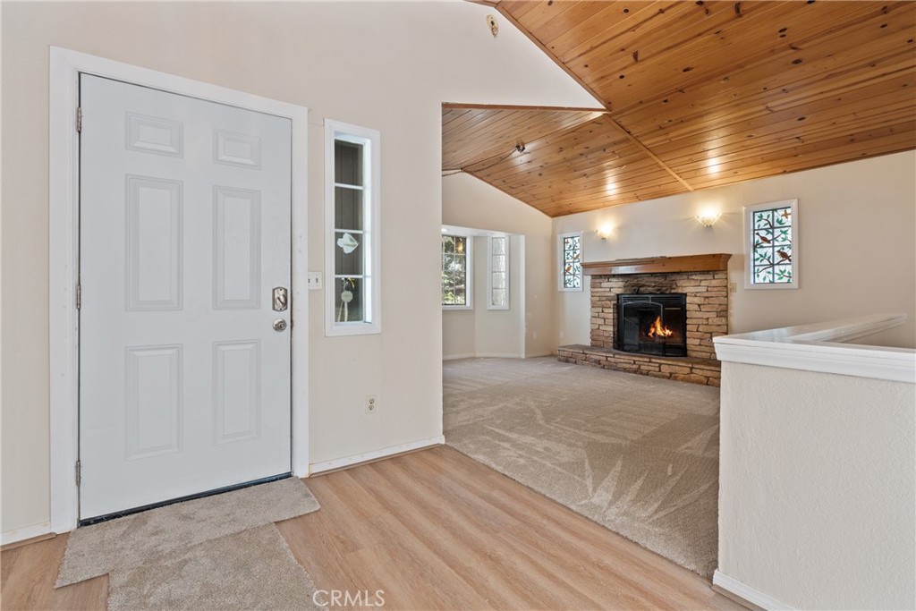 23561 Short Way Crestline, CA 92325 - Photo 4 of 18 a view of empty room with a fireplace and dryer