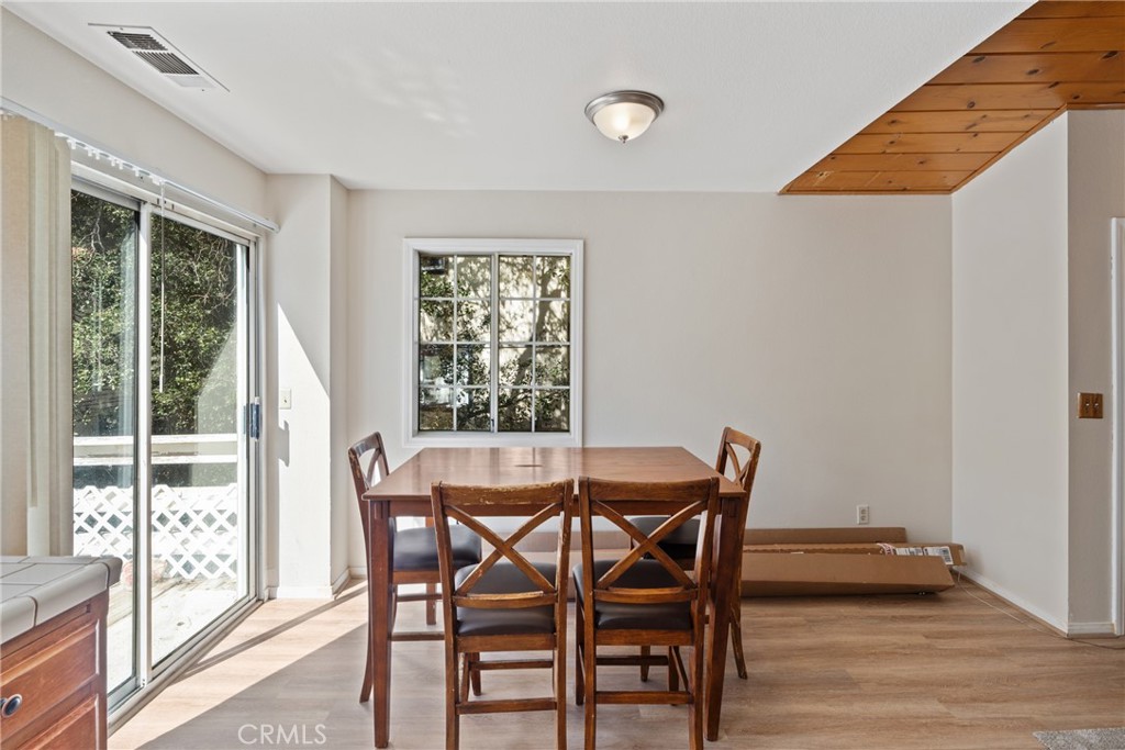 23561 Short Way Crestline, CA 92325 - Photo 8 of 18 a view of a dining room with furniture and wooden floor