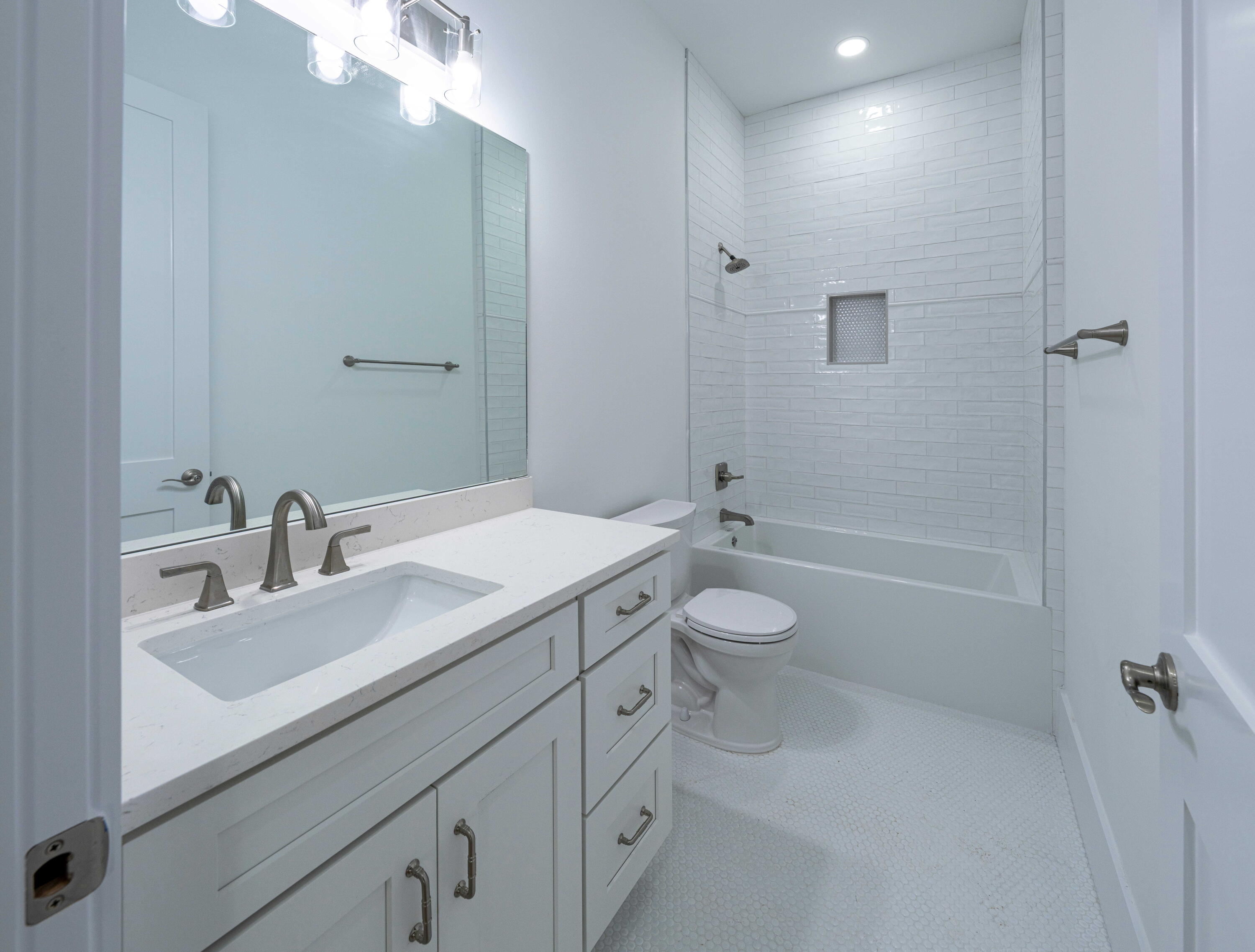 142 4th Street Santa Rosa Beach, FL 32459 - Photo 14 of 26 a bathroom with a sink a toilet and shower