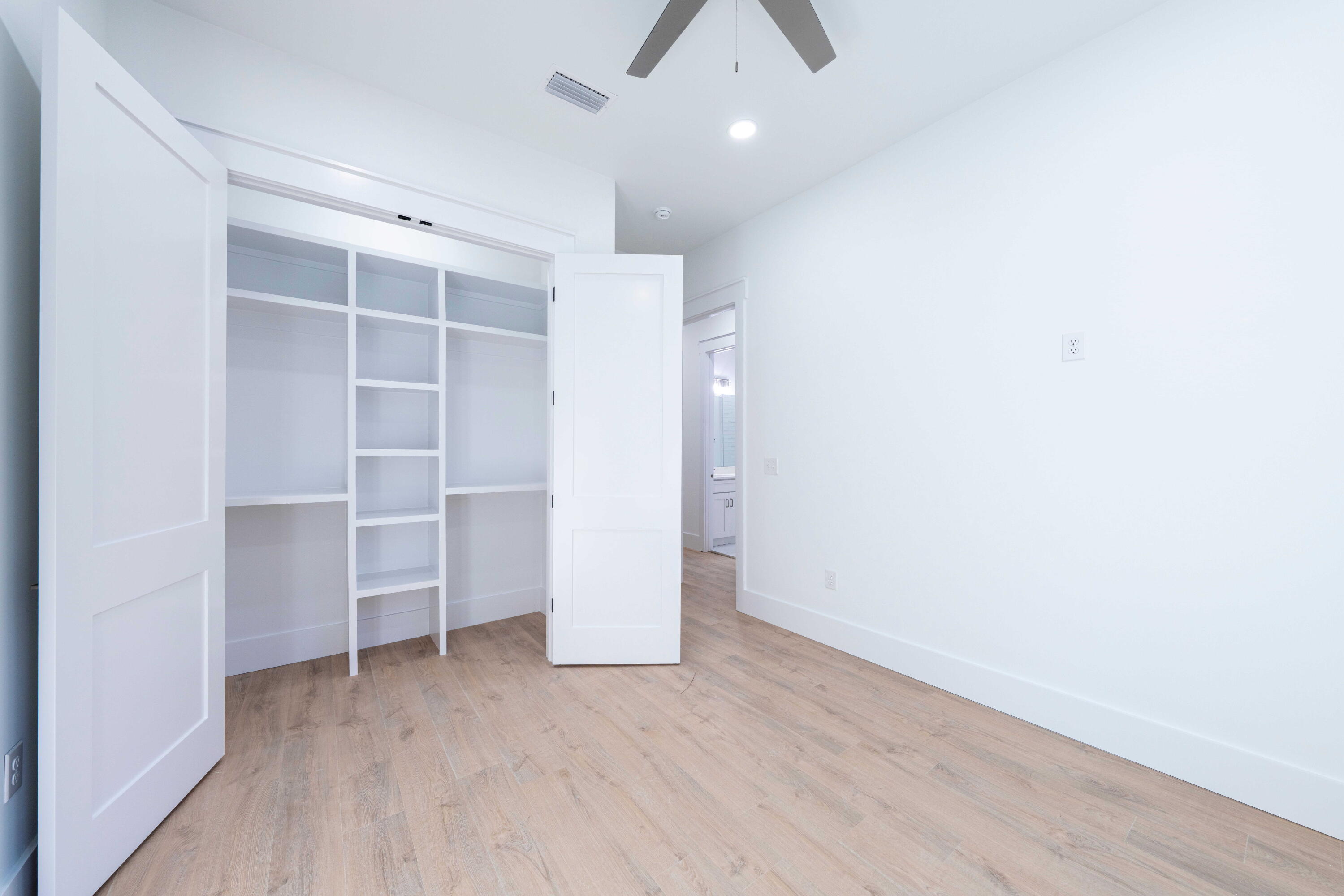 142 4th Street Santa Rosa Beach, FL 32459 - Photo 16 of 26 wooden floor in an empty room