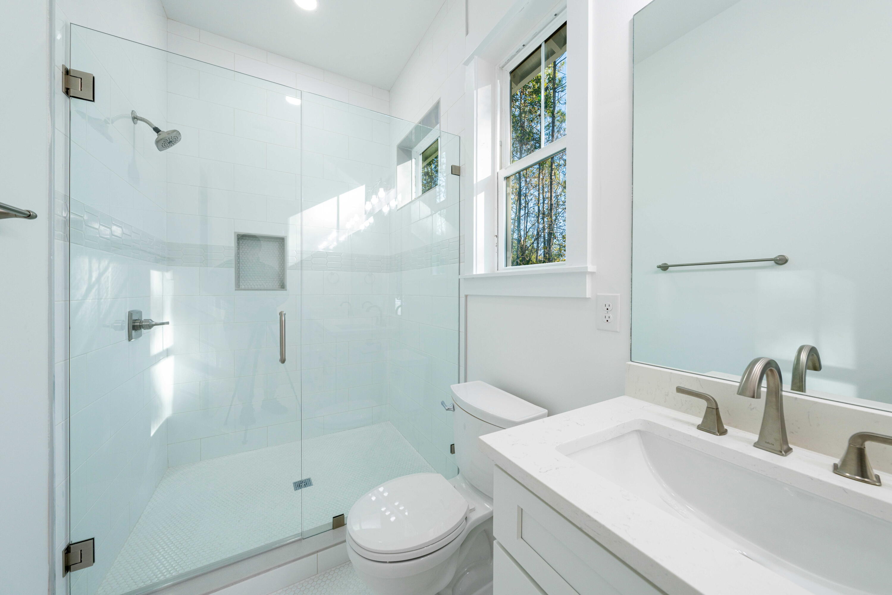 142 4th Street Santa Rosa Beach, FL 32459 - Photo 20 of 26 a bathroom with a sink a toilet and shower