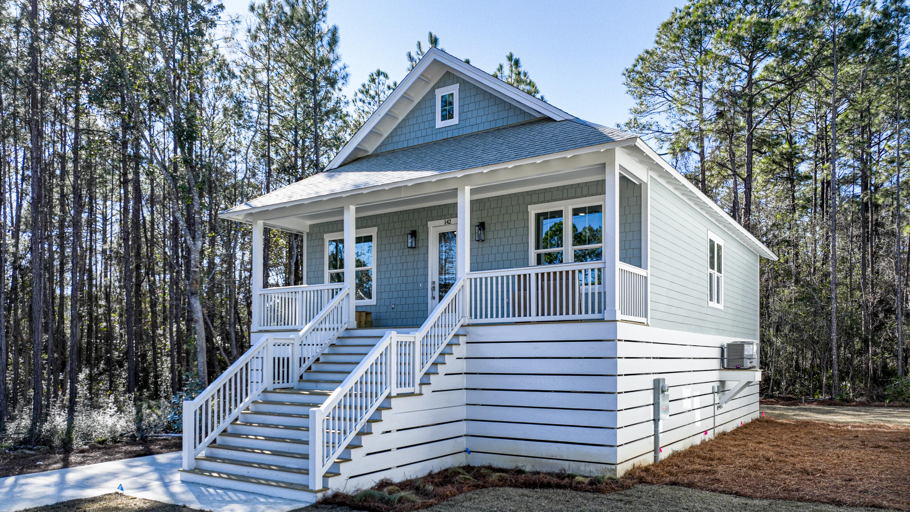 142 4th Street Santa Rosa Beach, FL 32459 - Photo 2 of 26 a view of a house with a yard