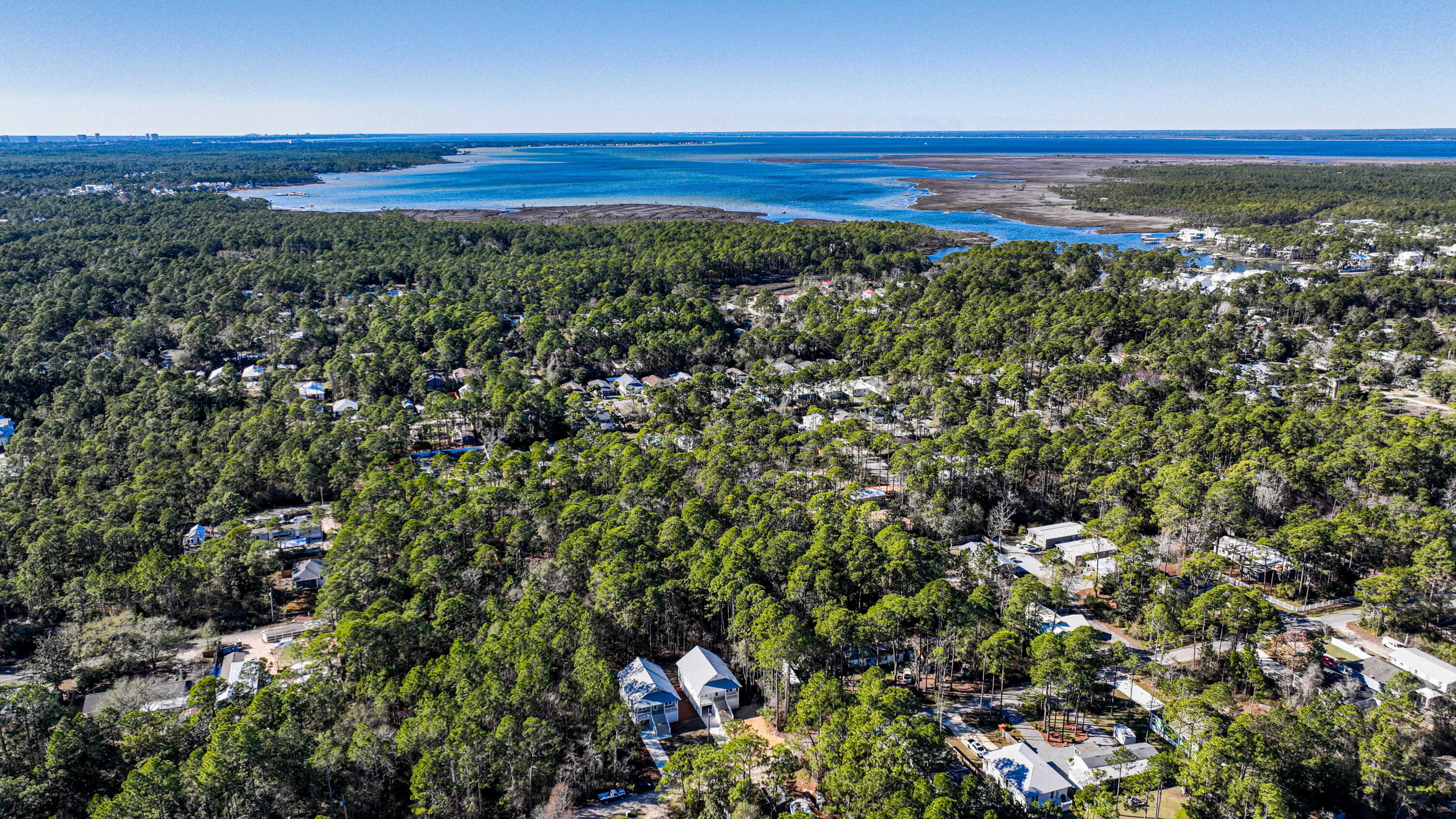 142 4th Street Santa Rosa Beach, FL 32459 - Photo 25 of 26 a view of a large body of water with a building in the background