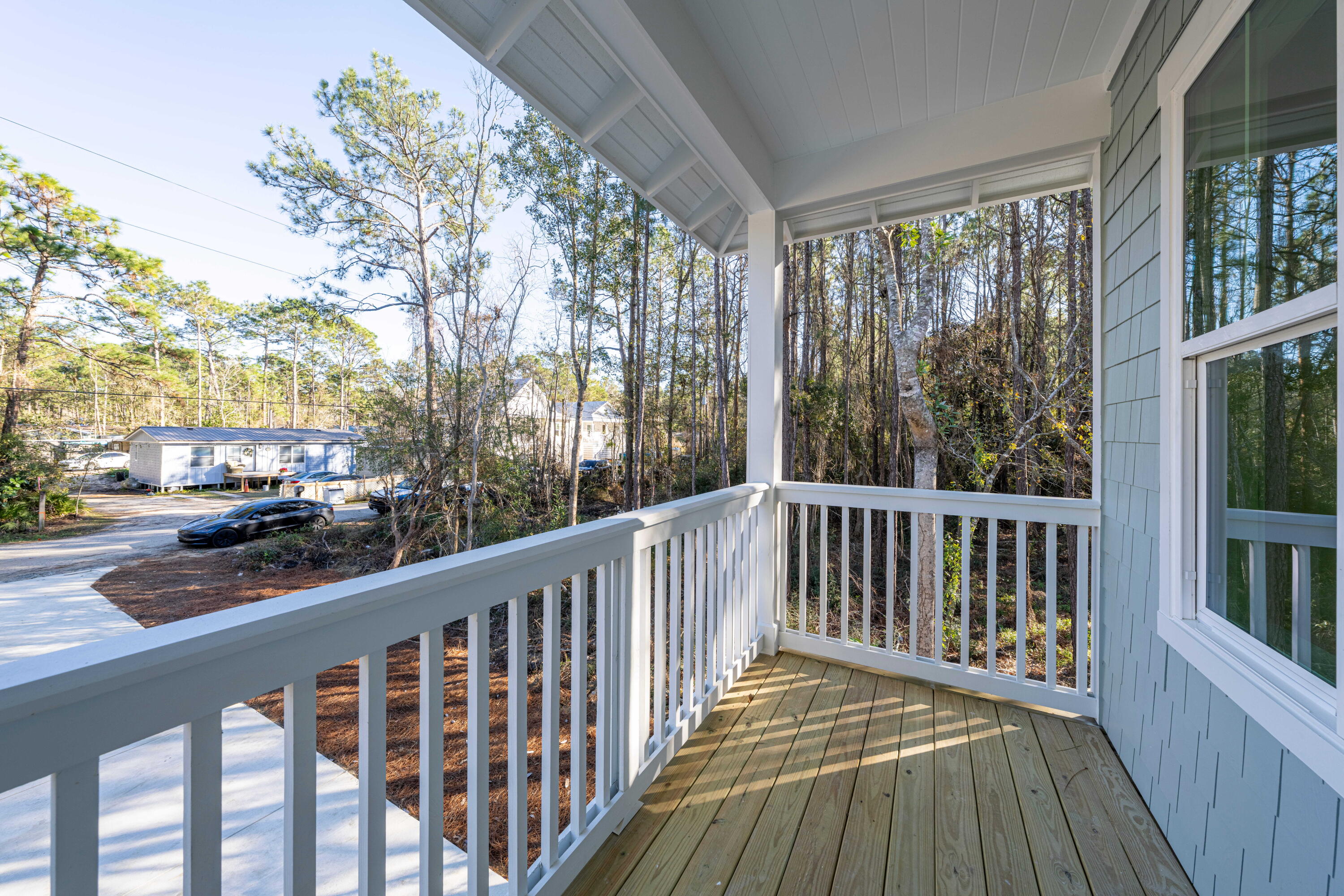 142 4th Street Santa Rosa Beach, FL 32459 - Photo 3 of 26 a view of a two chairs in the balcony