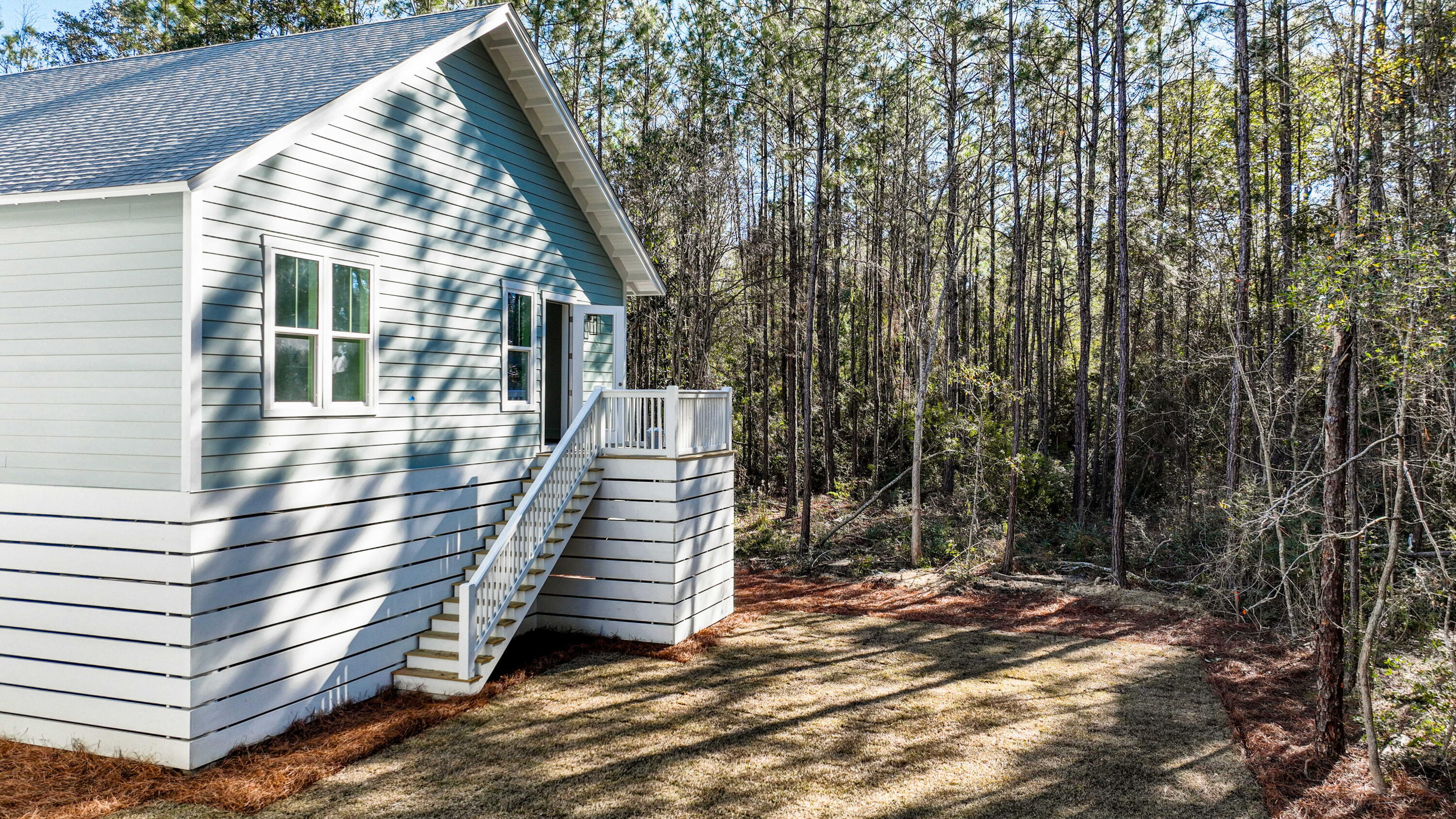 142 4th Street Santa Rosa Beach, FL 32459 - Photo 4 of 26 a view of outdoor space and deck