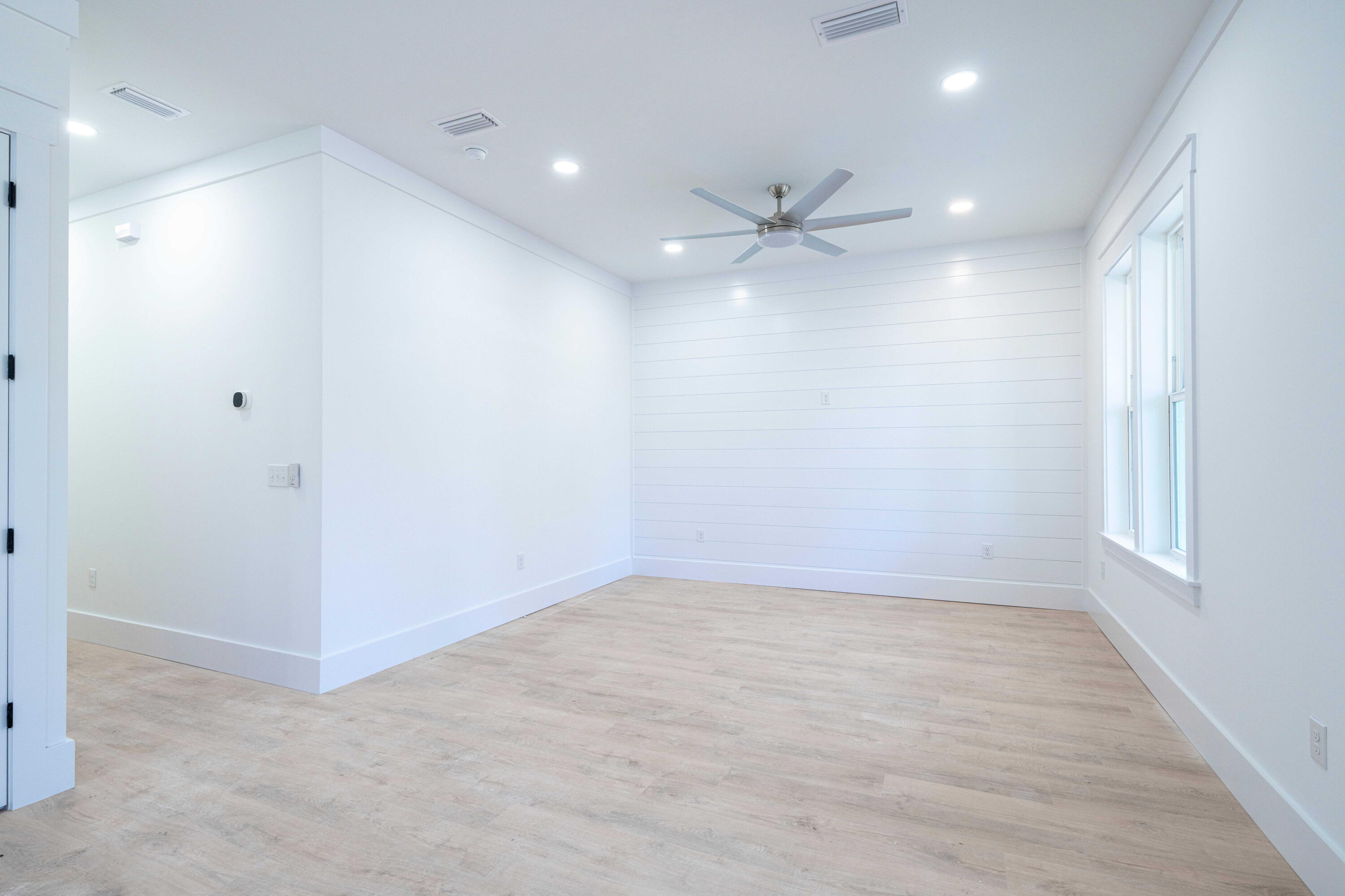 142 4th Street Santa Rosa Beach, FL 32459 - Photo 9 of 26 an empty room with fan and entrance