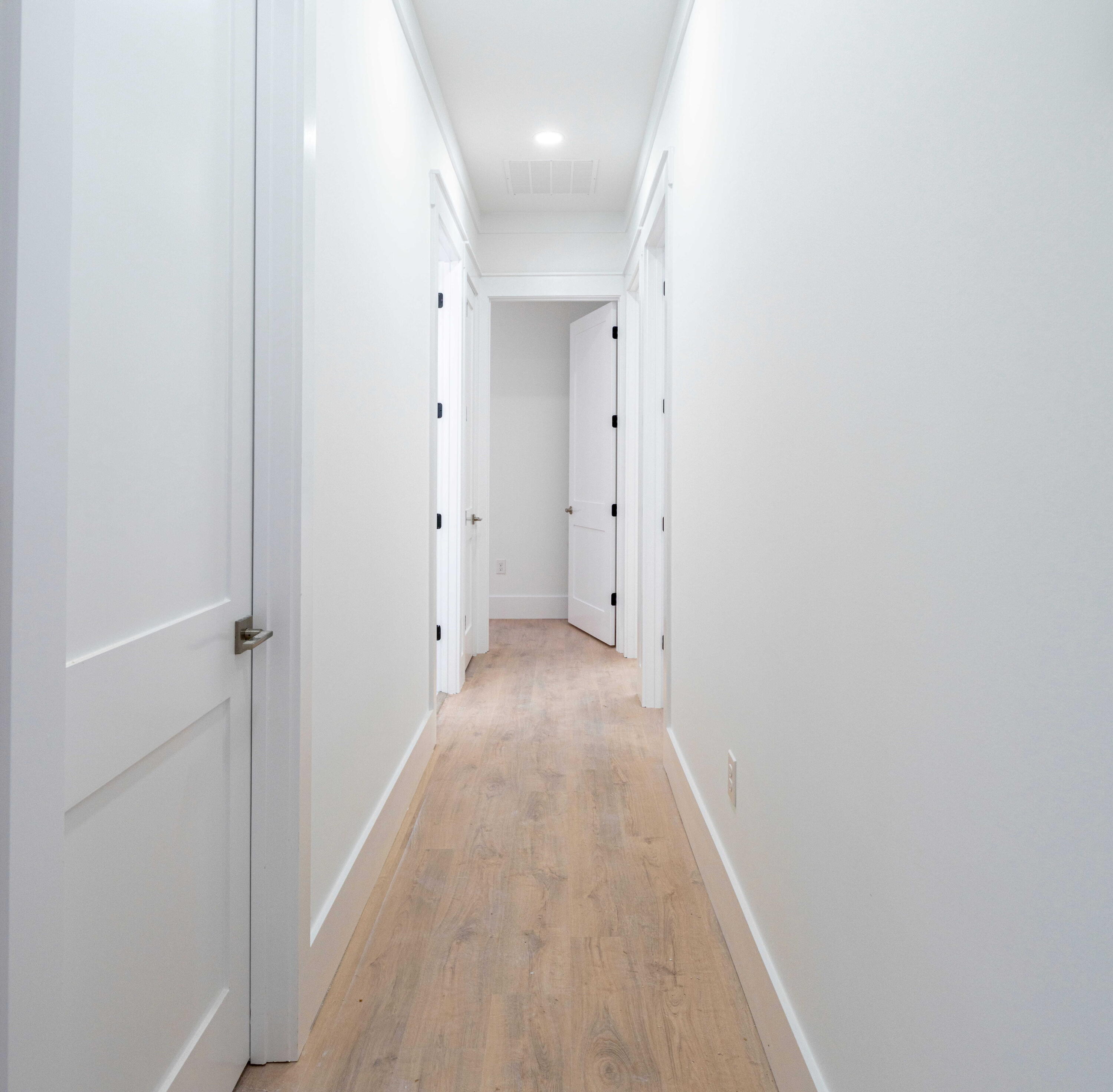 142 4th Street Santa Rosa Beach, FL 32459 - Photo 10 of 26 a view of a hallway with wooden floor