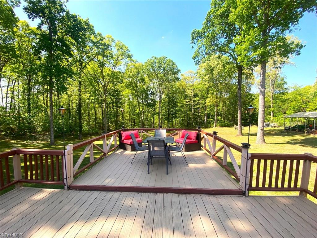 1350 Bethania-Rural Hall Road Winston-Salem, NC 27106 - Photo 5 of 29 If you have 3.7 acres of land you would definitely want to enjoy it. THis wonderful oversized deck allows you to do just that.