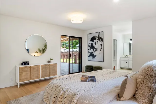 a bedroom with a large bed and a large window