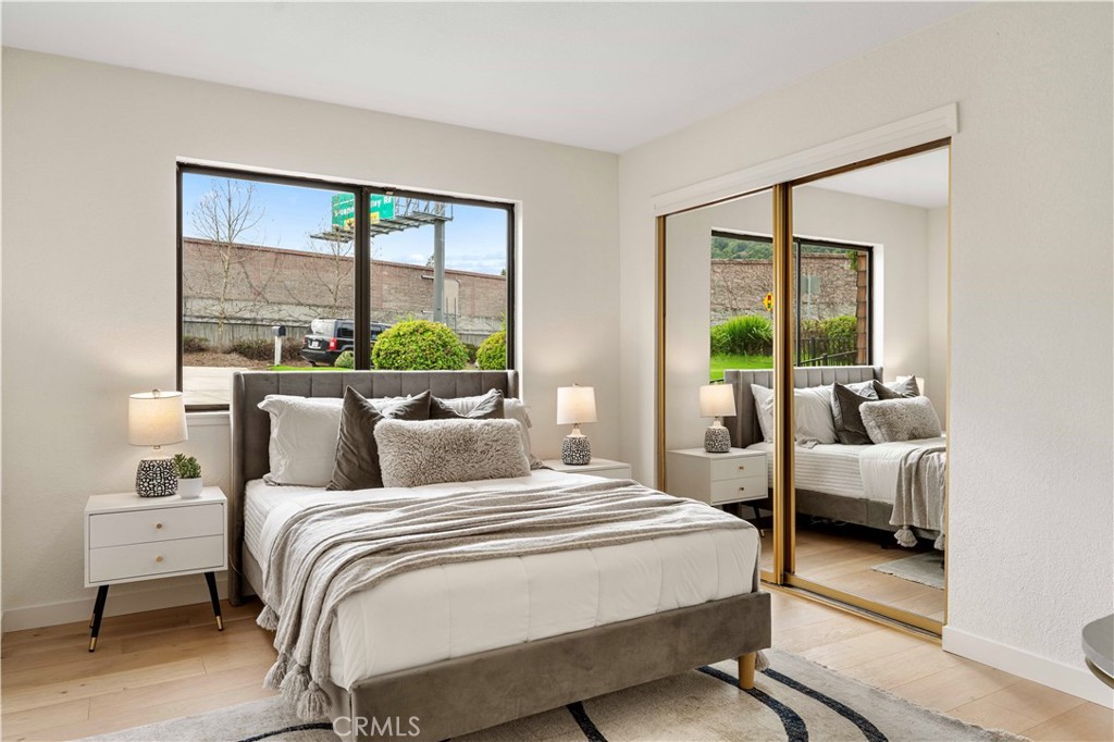 931 Camino Ramon Danville, CA 94526 - Photo 16 of 67 a bedroom with a bed and large windows