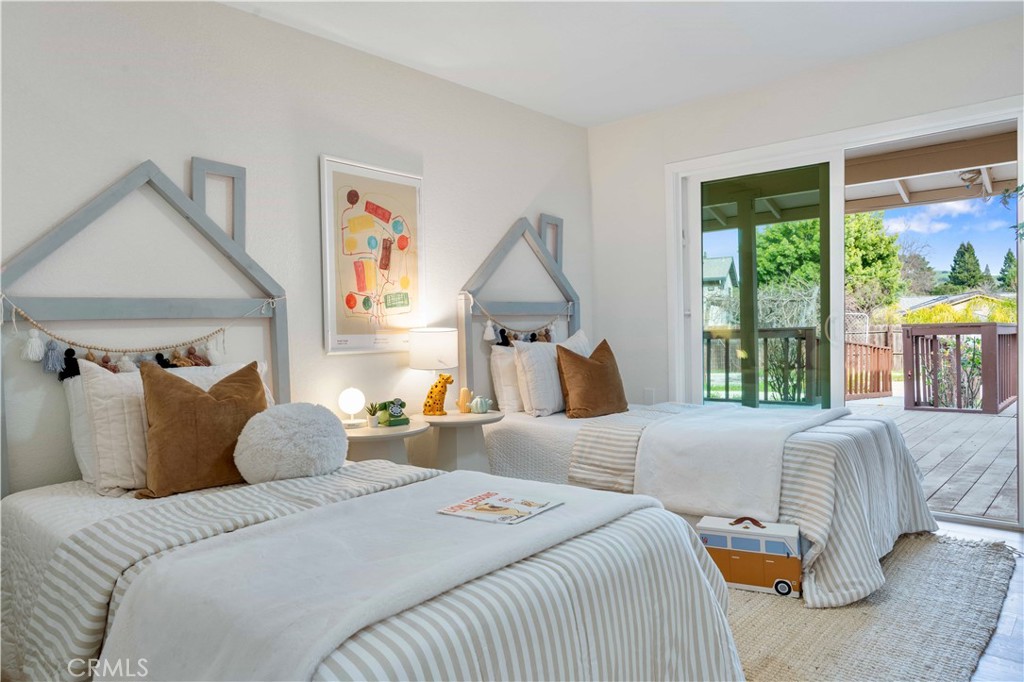 931 Camino Ramon Danville, CA 94526 - Photo 18 of 67 a bedroom with a large bed and a large window