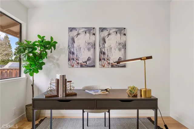 a view of a dining room with furniture and window
